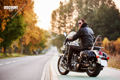 Man on a motorcycle parked on the side of the road